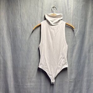 Babaton White body suit High Cut neckline size medium